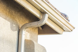 a photo seamless rain gutter installed in a house 